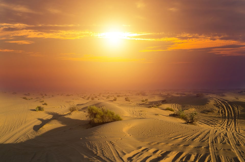 Sunrise Over Desert Dunes
